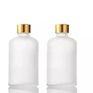 Round long silver with gold cap